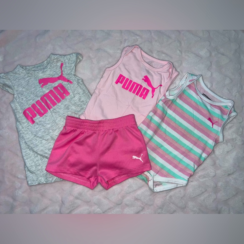 Puma set. 2 onesies, 1 short set, 1 pair of shorts. Size 3-6 months.
